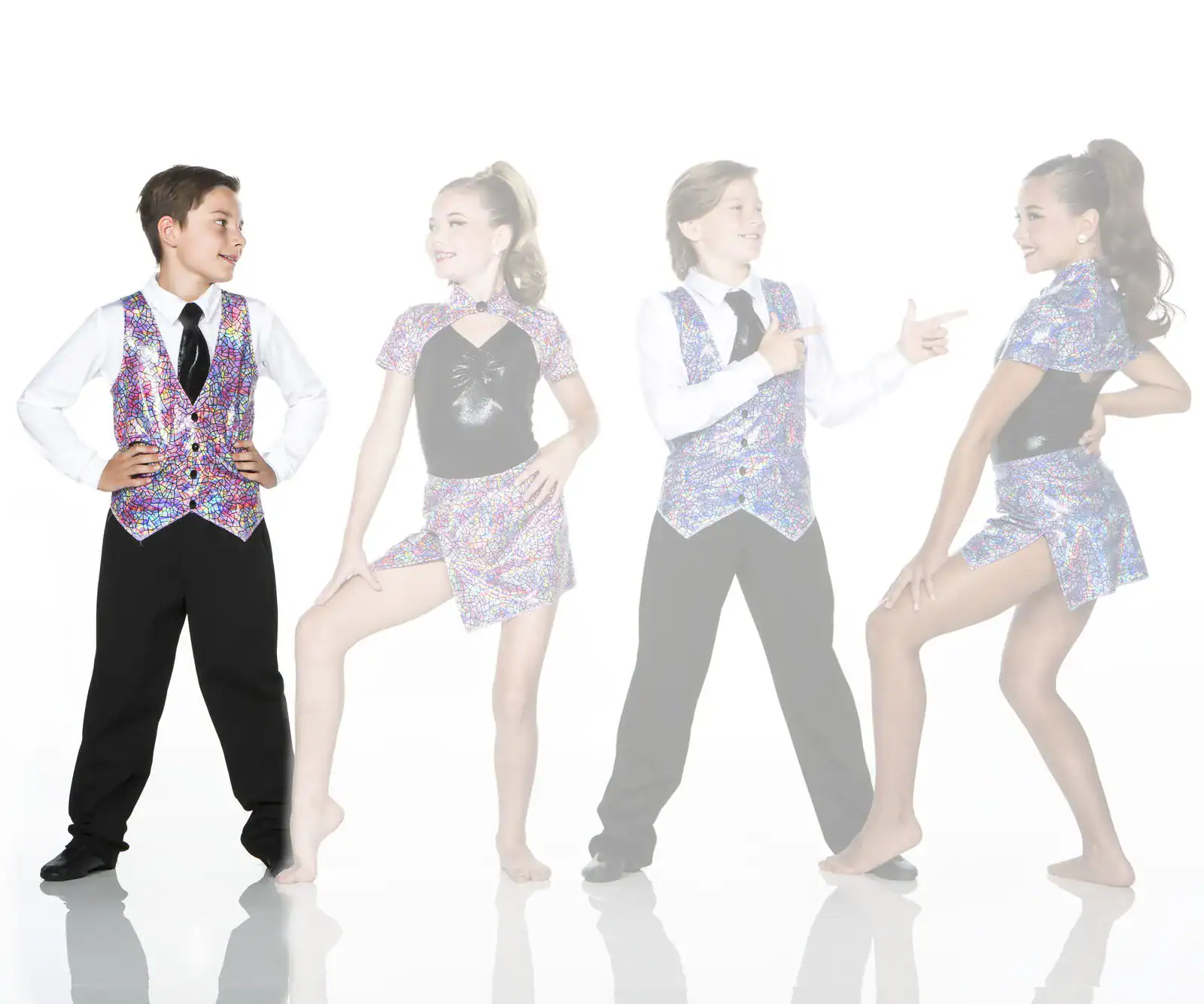 Four young dancers wearing colorful mosaic-patterned costumes pose together.