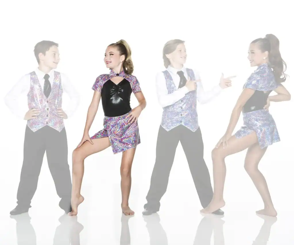 Four young dancers wearing colorful mosaic-patterned costumes pose together.