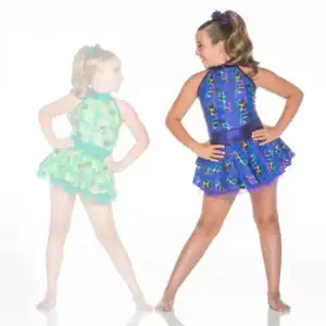 Two girls wearing colorful patterned dance costumes pose together.