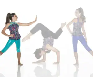 Three girls in colorful dancewear pose against a white background.