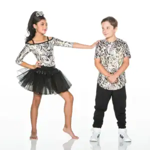 Two children wearing matching abstract-patterned outfits on white background.