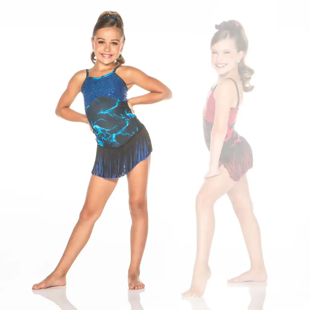 Young dancer modeling blue fringed costume, with faded pink version behind.