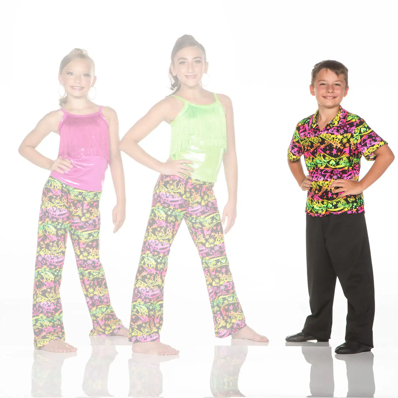 Three children wearing colorful dance costumes against white background