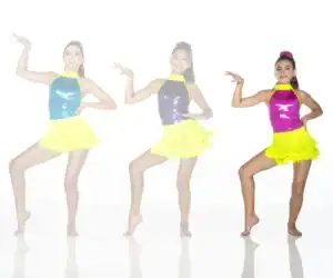 Three dancers modeling colorful fringe costumes against white background.
