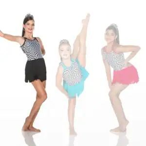 Three young dancers in checkered costumes pose against white background.