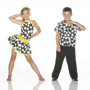 Two children wearing matching black floral dance costumes