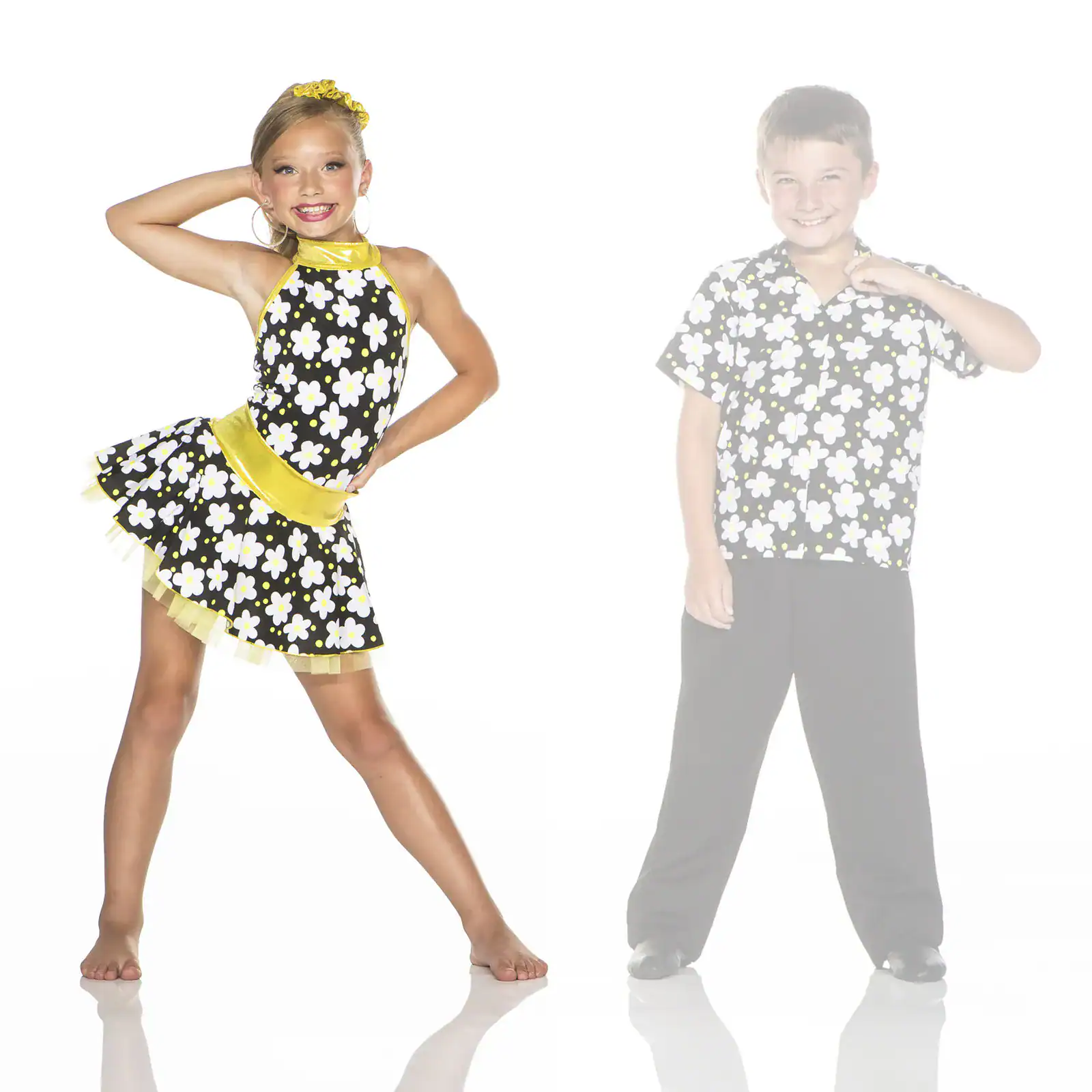Girl and faded boy wearing matching floral dance costumes