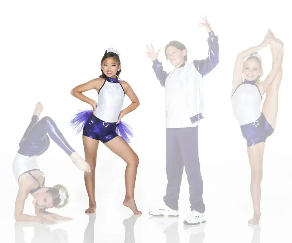 Four young dancers posing in purple and white costumes