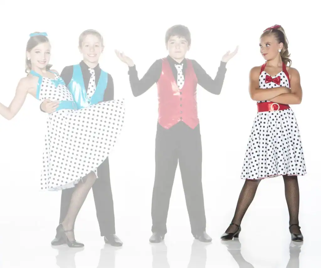 Children in colorful polka-dot dance costumes on white background