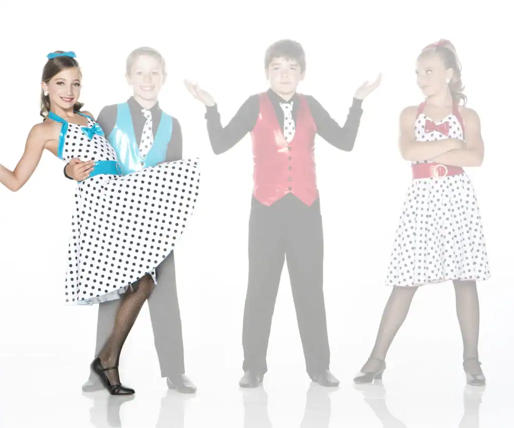 Four children in colorful polka-dot dance costumes