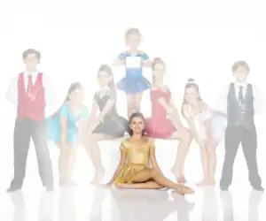 Young dancers in colorful costumes posing against white background