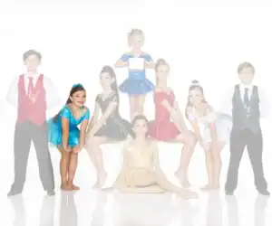 Young dancers in colorful costumes posing against a white background