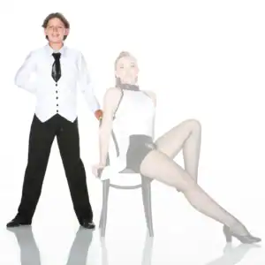 Two young dancers pose in black-and-white costumes.