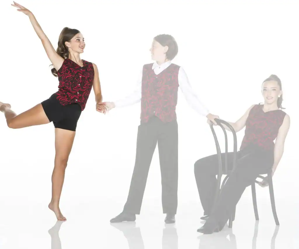 Three performers in coordinated red patterned costumes pose together.