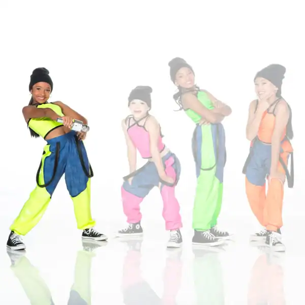Four girls in colorful hip-hop outfits pose on white background.
