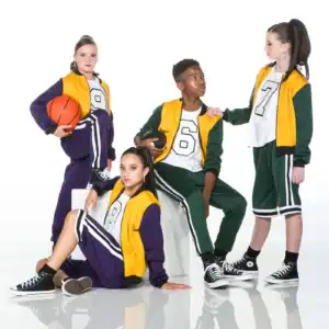 Four teens in varsity tracksuits pose with basketballs.
