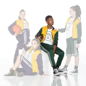 Four teens in varsity outfits pose with basketball and football.