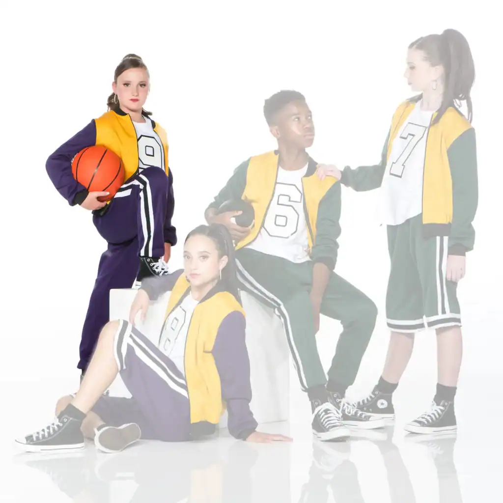 Four youths in varsity outfits pose with basketball and football.