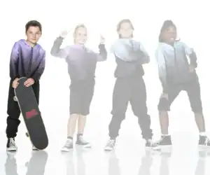 Four children in hoodies pose with a skateboard.