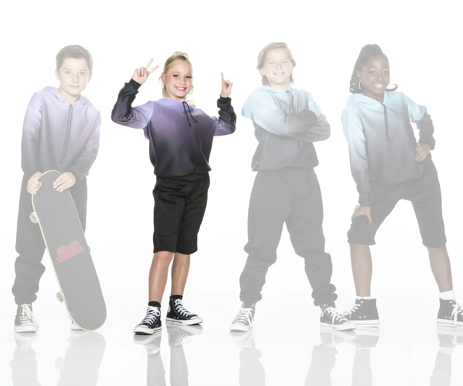 Four children modeling hoodies and sneakers, one holding skateboard
