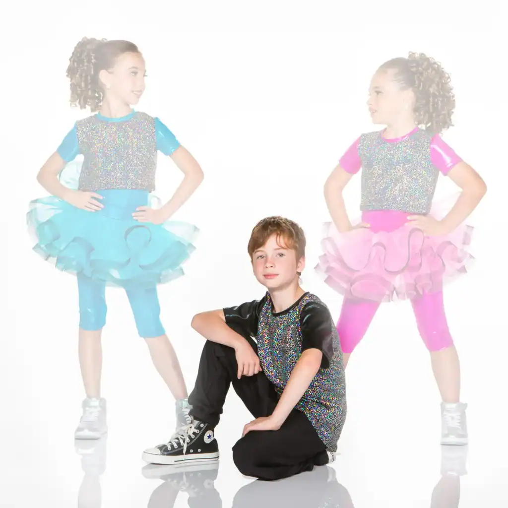 Three children in colorful glittery dance costumes
