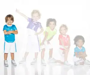 Five children wearing colorful shiny athletic outfits