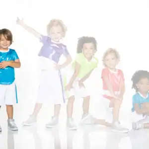 Five children wearing colorful shiny athletic outfits