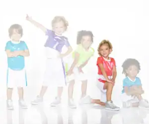 Five children in colorful outfits posing against a white background
