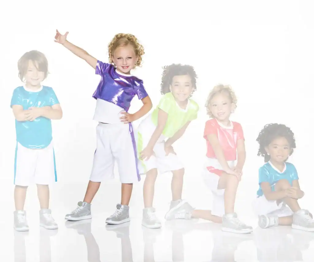 Five children wearing colorful shiny shirts and white shorts