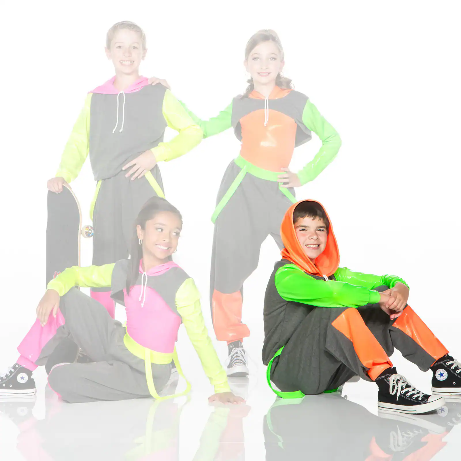 Four children in colorful neon streetwear pose together.
