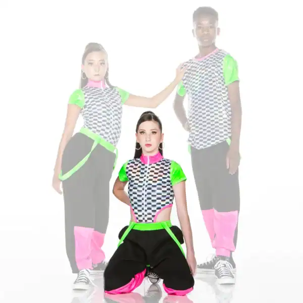 Three dancers in neon checkerboard outfits pose against white background.