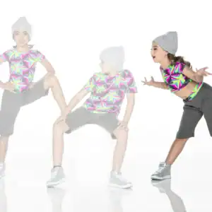 Three children pose in colorful geometric shirts and gray beanies.