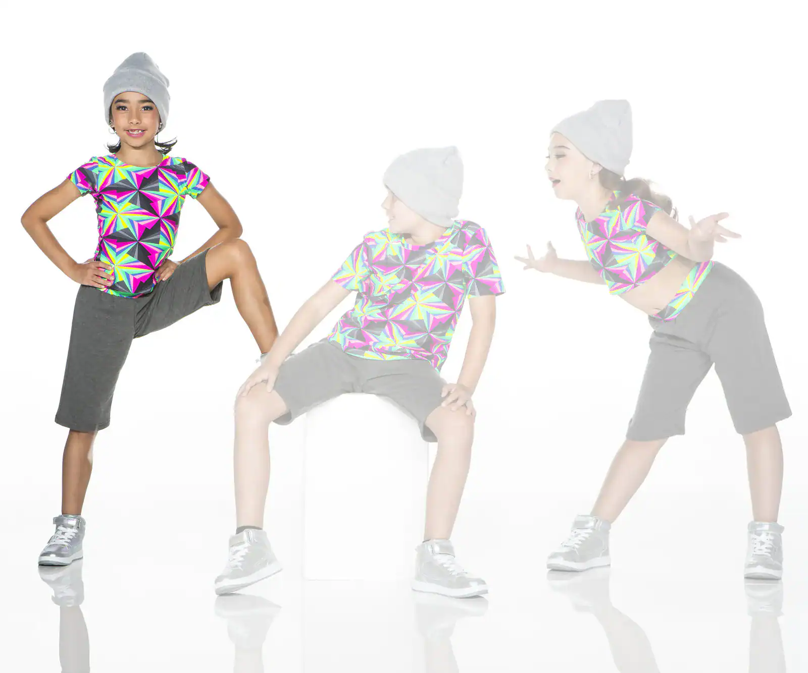 Girl in colorful geometric shirt poses in three dance stances