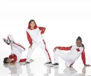 Three dancers in red and white Canada-themed costumes posing
