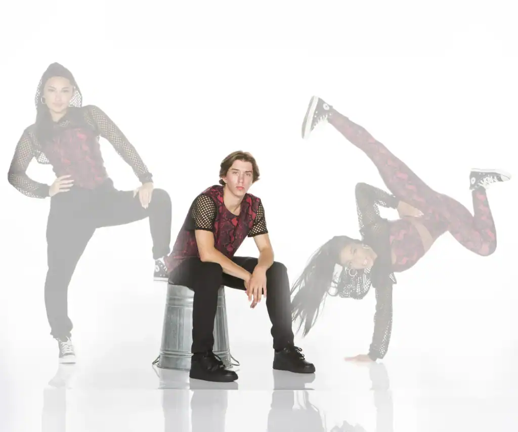 Man seated between two posed images of a female dancer
