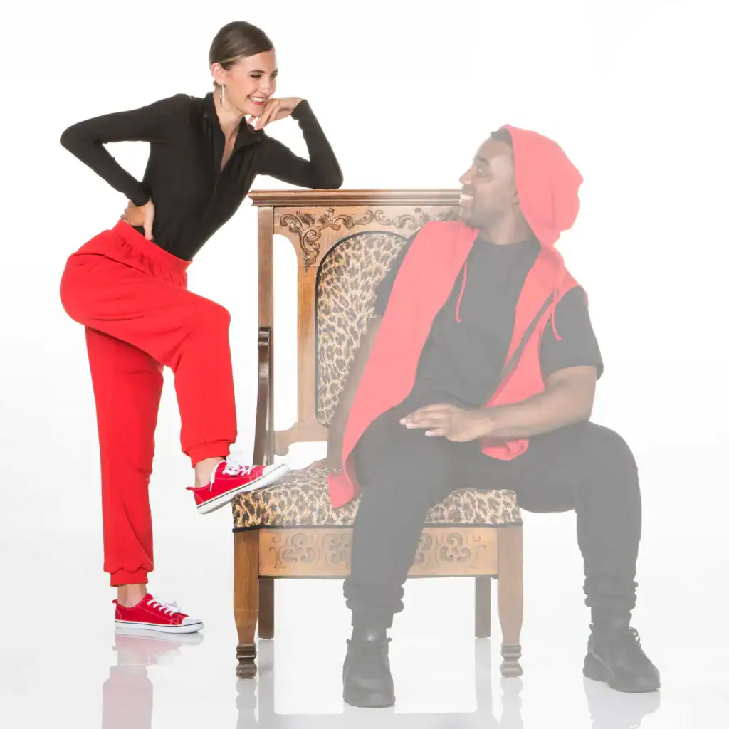 Woman and man in red and black outfits smiling together