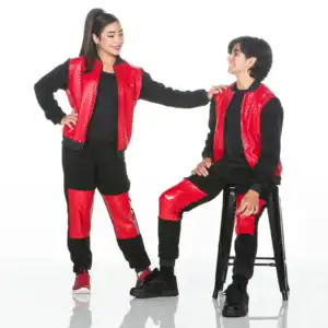 Two people wearing matching red and black outfits