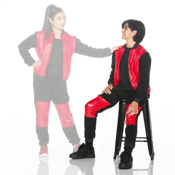 Two models wearing red and black outfits, one seated.