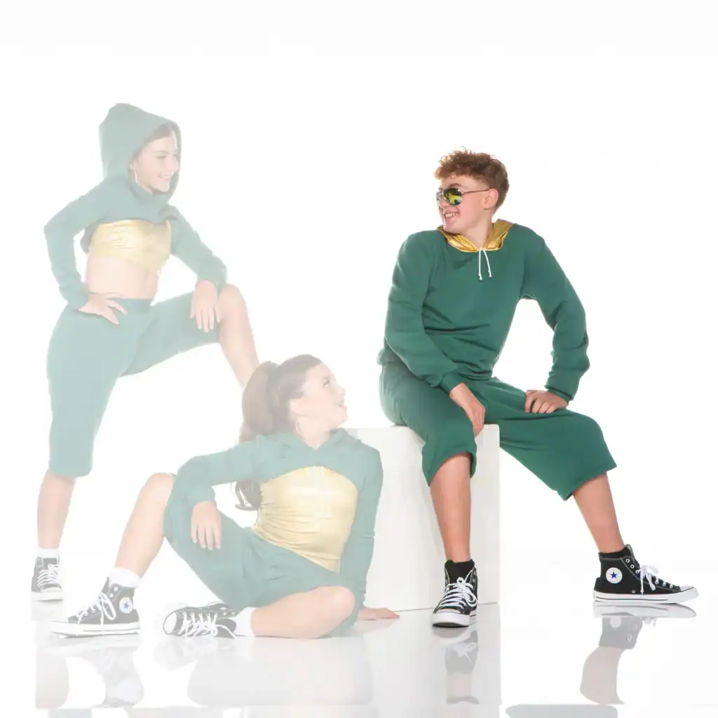 Three youths wearing green outfits and black high-top sneakers