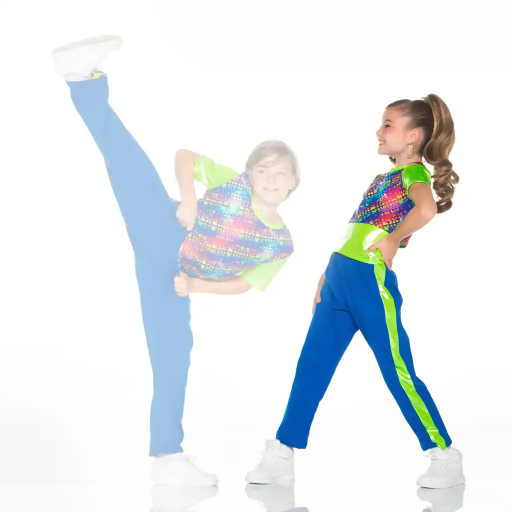 Two children in colorful outfits dancing, one doing a high kick.