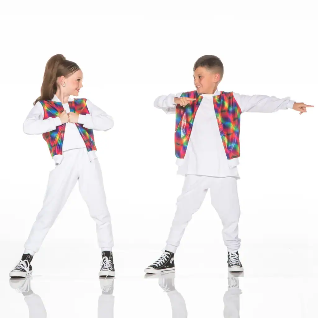 Two children in colorful vests dancing against white background