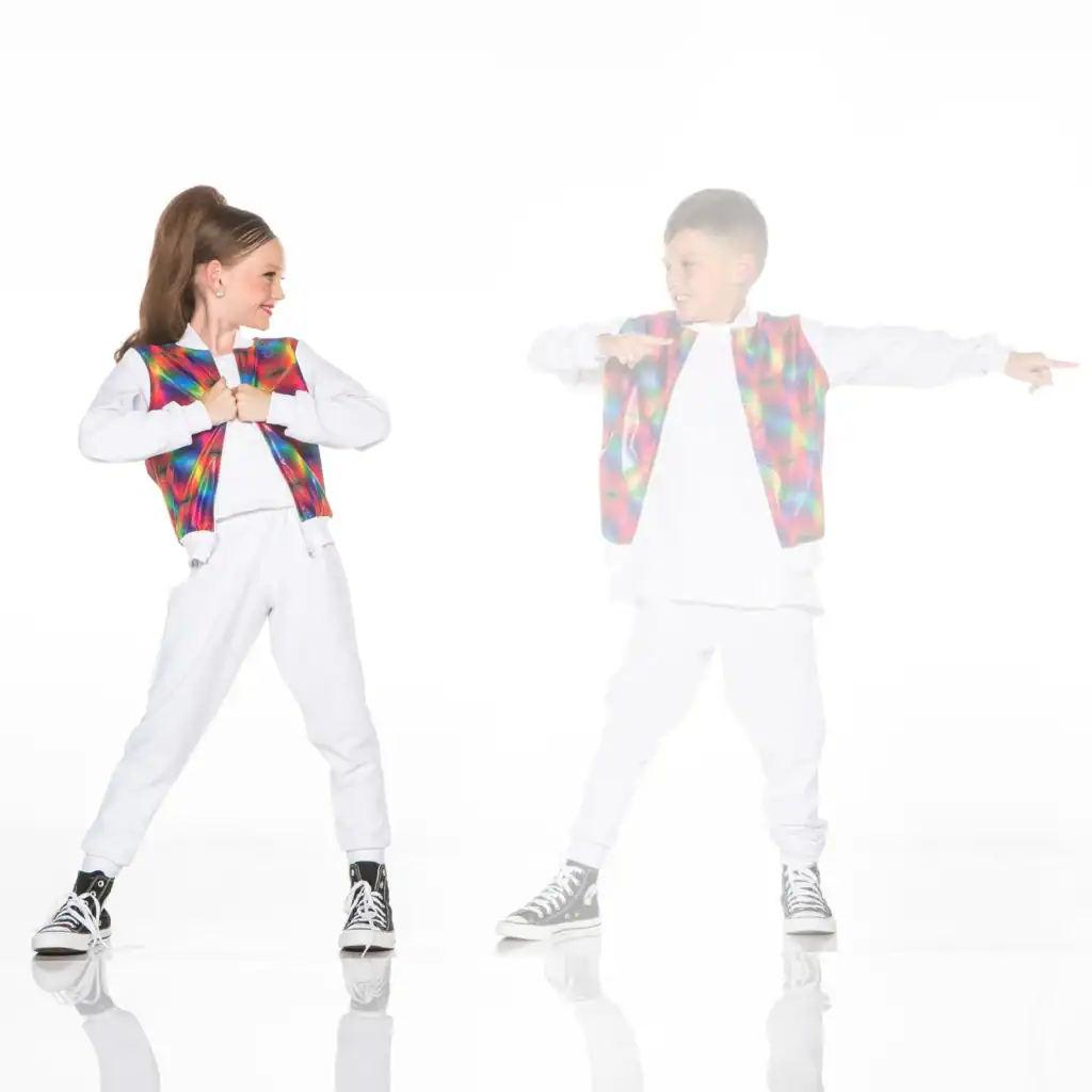 Two children dance in colorful vests against white background.