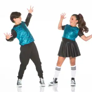 Two children dancing in matching blue sequined tops