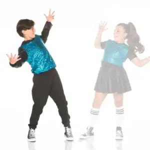Two young dancers in blue sequined outfits posing enthusiastically