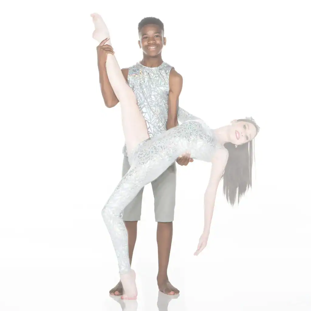 Dancer lifts partner in sparkling silver costumes