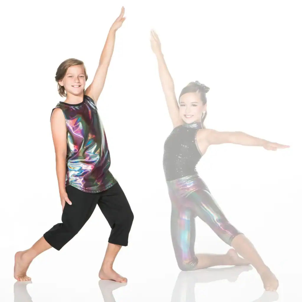 Two young dancers pose in shimmering performance outfits.