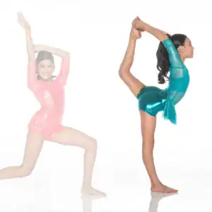 Gymnast in turquoise leotard performs standing leg hold pose.