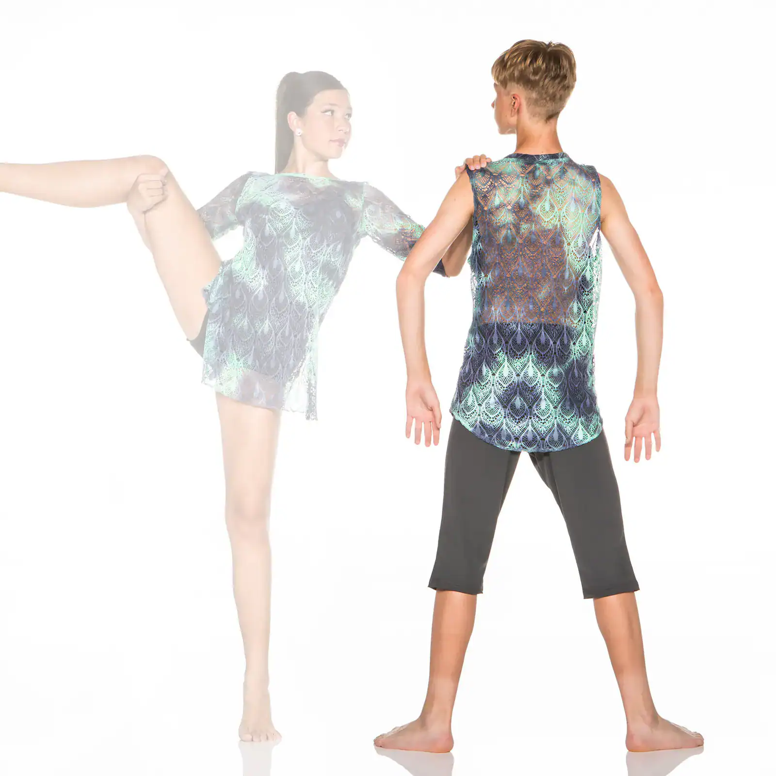 Young dancers modeling patterned costumes in a studio