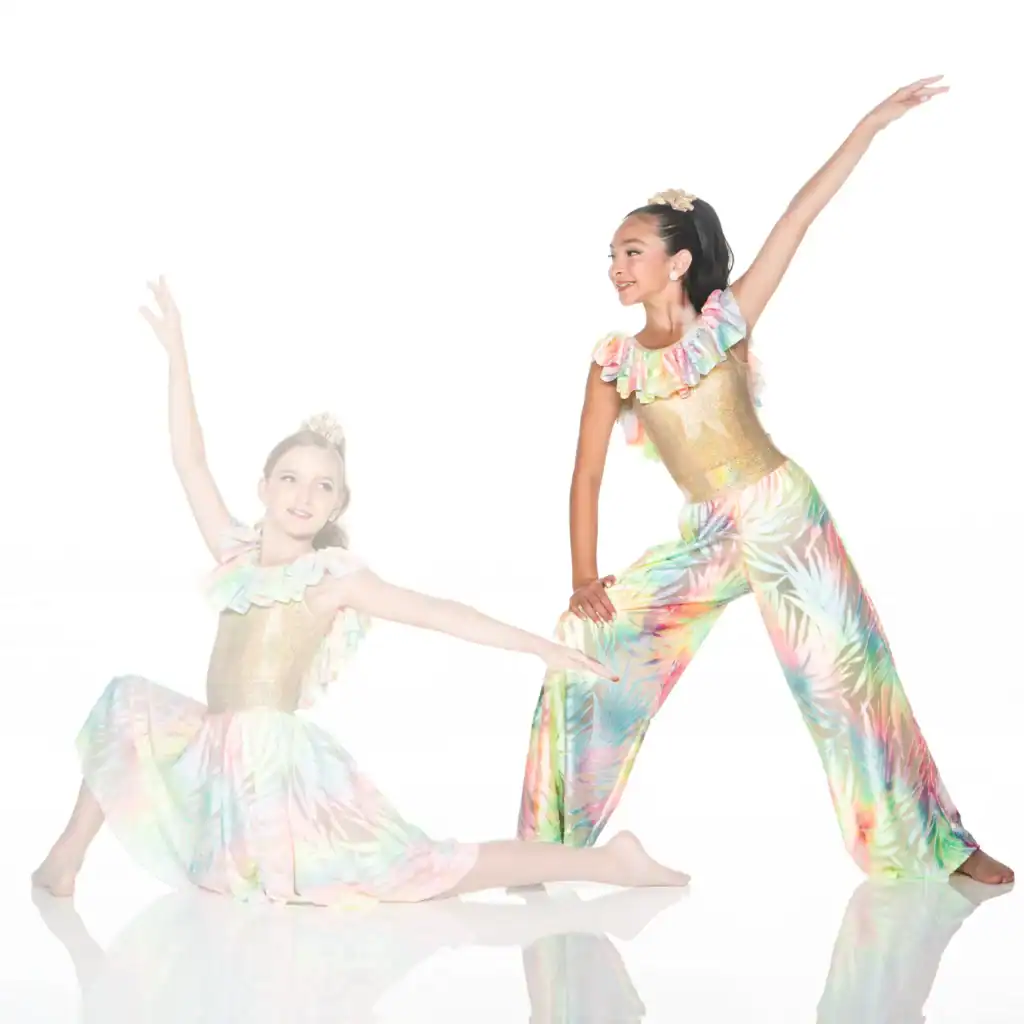 Two young dancers posing in colorful tropical costumes