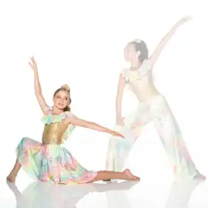 Two young dancers in pastel costumes striking graceful poses